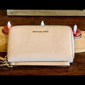 Michael Kors zip around wallet.